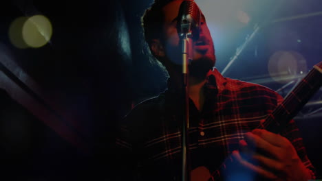 singing and playing guitar, musician performing on stage with light effects animation