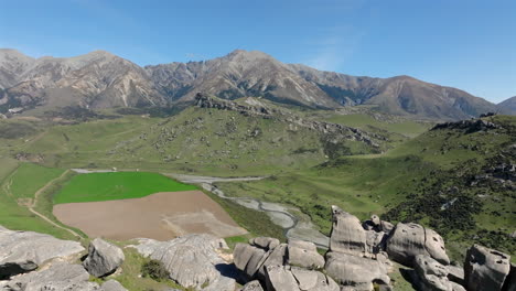 a stunning aerial drone shot capturing the iconic rocky terrain of flock hill and castle hill in new zealand.