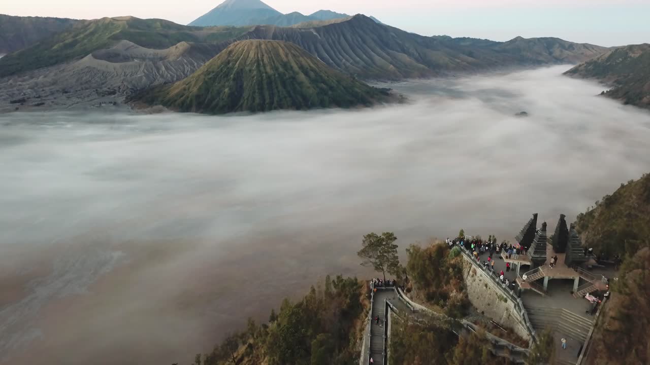 Beautiful view of Mount Bromo National Park in the morning with thin mist covering the area.