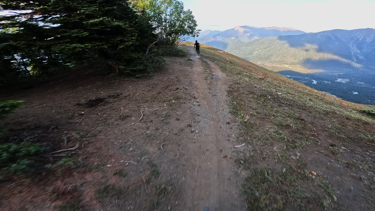POV Mountain Biker Riding on a Scenic Mountain Trail