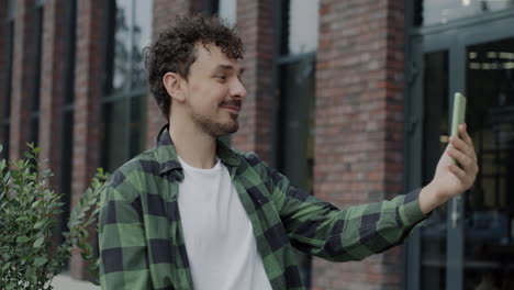 young man taking a selfie outdoors