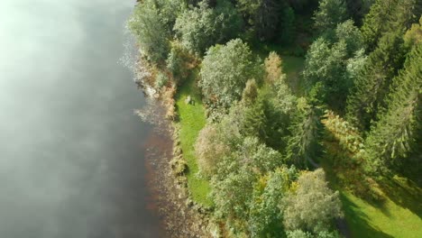 revealing campsite by river, drone shot