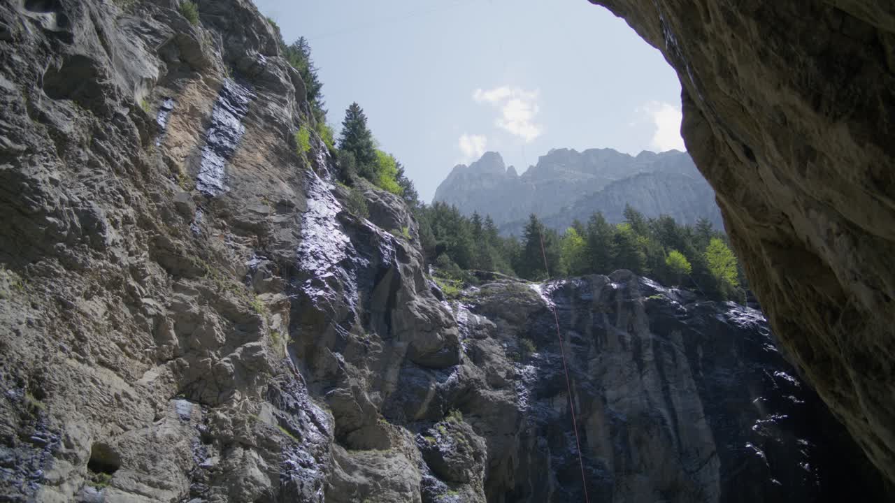 Water on mountainside rocks of canyon | grindelwald switzerland cave in ...