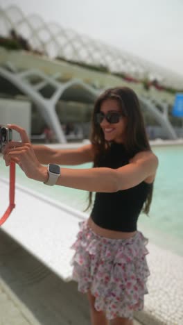 woman taking selfie in modern urban park