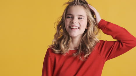 teenage caucasian girl dancing in front of the camera.