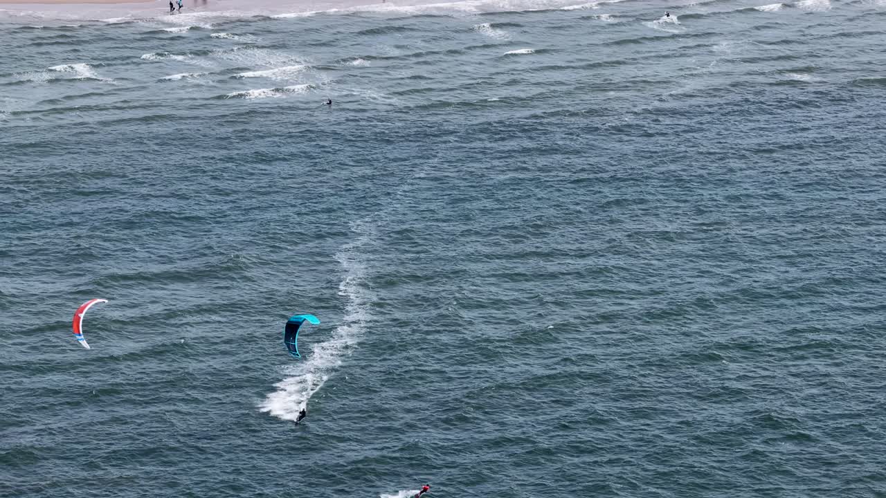 Kite surfing, sports and recreation, coast, north sea, water sports. Aerial drone view.