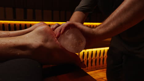 ice foot massage in sauna
