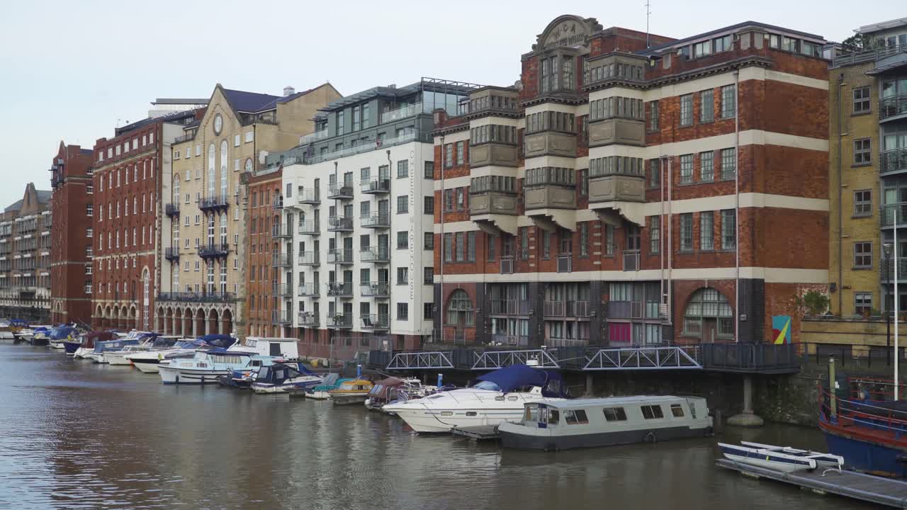 BRISTOL, SOMERSET, ENGLAND, December 23, 2019: Bristol city harbour. Avon river. Close up on the  beautiful buildings and boats on the right side of the harbour.