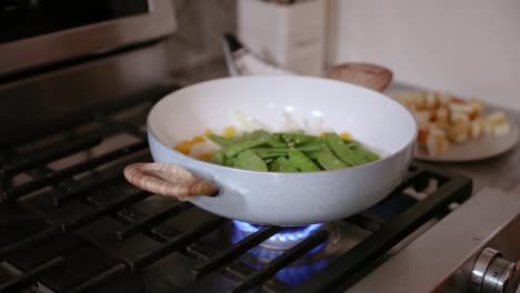 close up of pan of cooking vegetables in slow motion