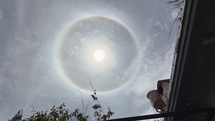 Magnificent Solar Halo Phenomenon in Sky Above Building, Low Angle Panning Slow of