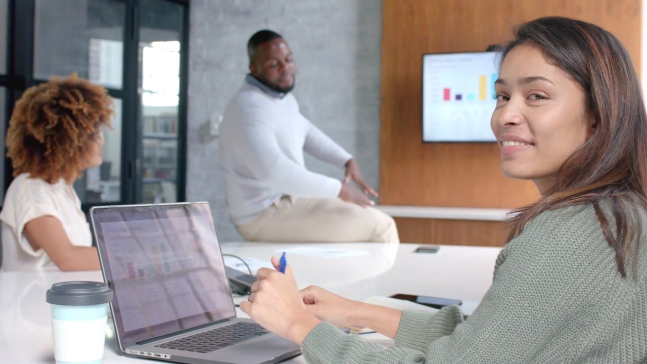 Right woman typing on laptop man presenting chart, activating marketing engagement overlays smiling