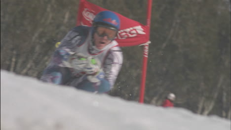 a person skies down hill through a slalom course 1