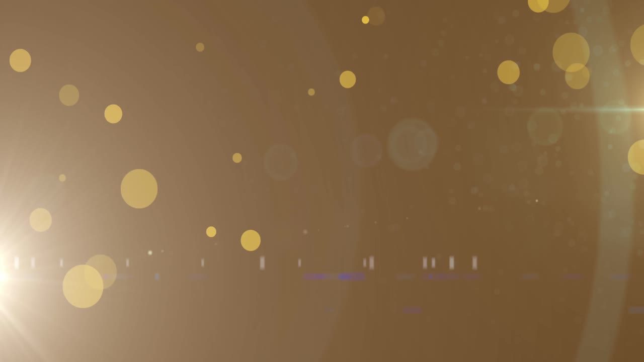 Animation of light spots and trails on black background