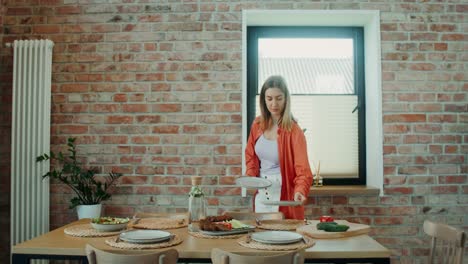 woman setting the dinner table