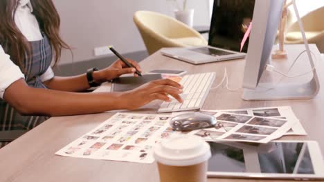 female graphic designer using graphic tablet