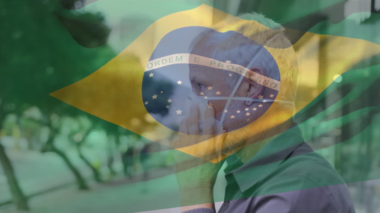 Animação da bandeira do Brasil tremulando sobre homem com máscaras faciais.