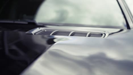 close-up of a car hood with a metal grill