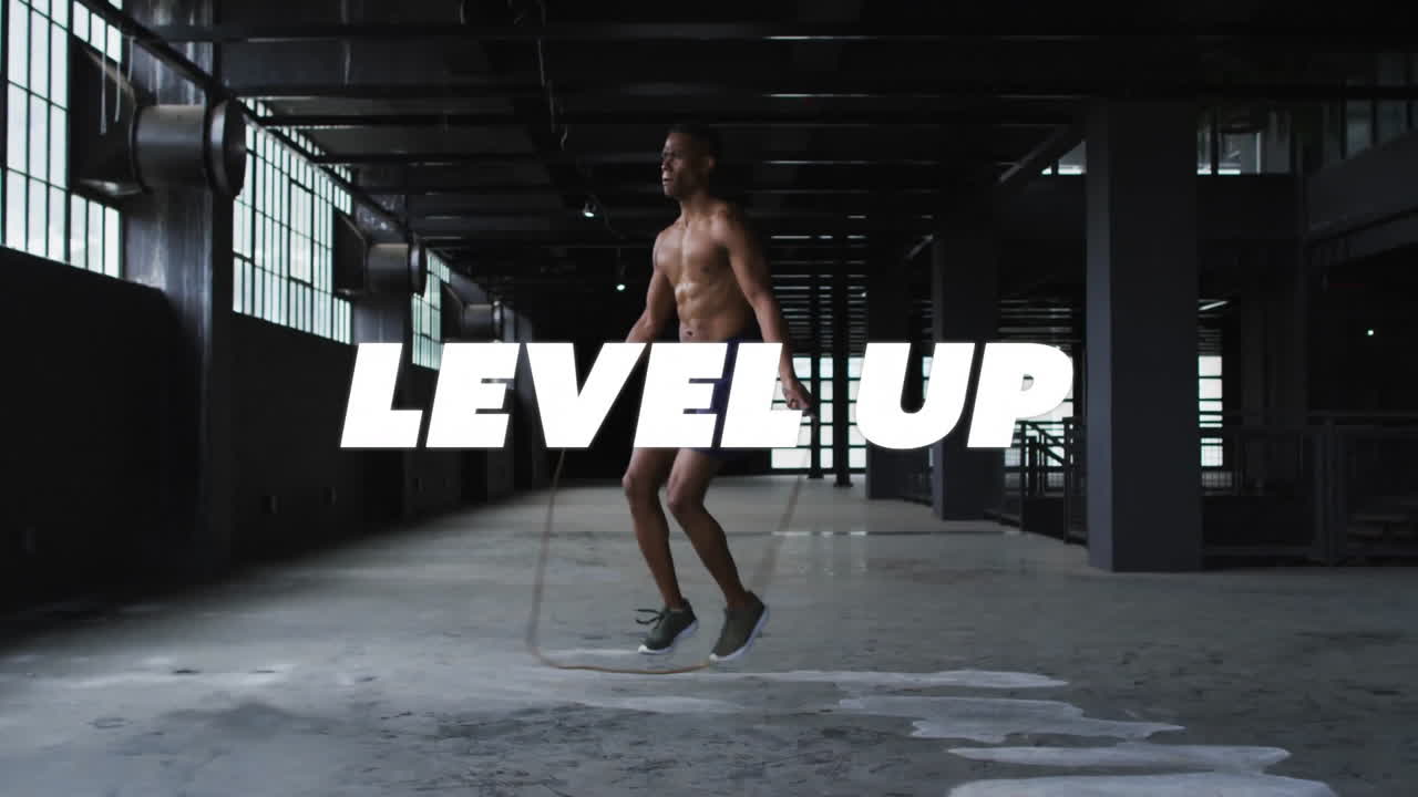 Jumping rope in industrial gym, LEVEL UP text animation over athlete