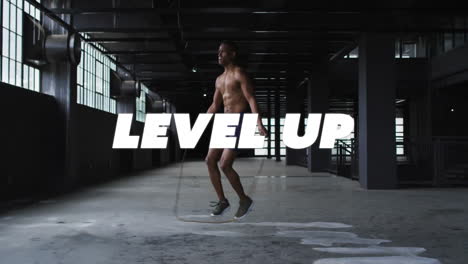 jumping rope in industrial gym, level up text animation over athlete