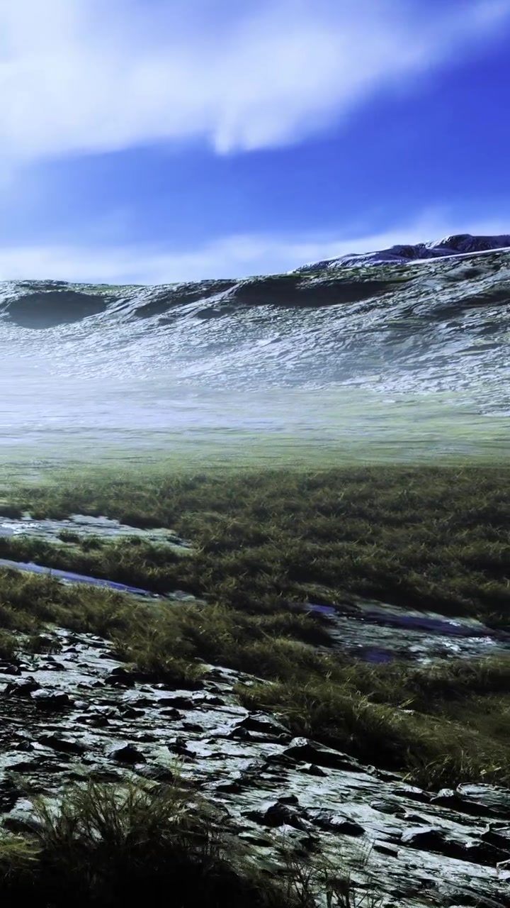 Paisagem com grama e rochas sob um céu claro perto de montanhas.