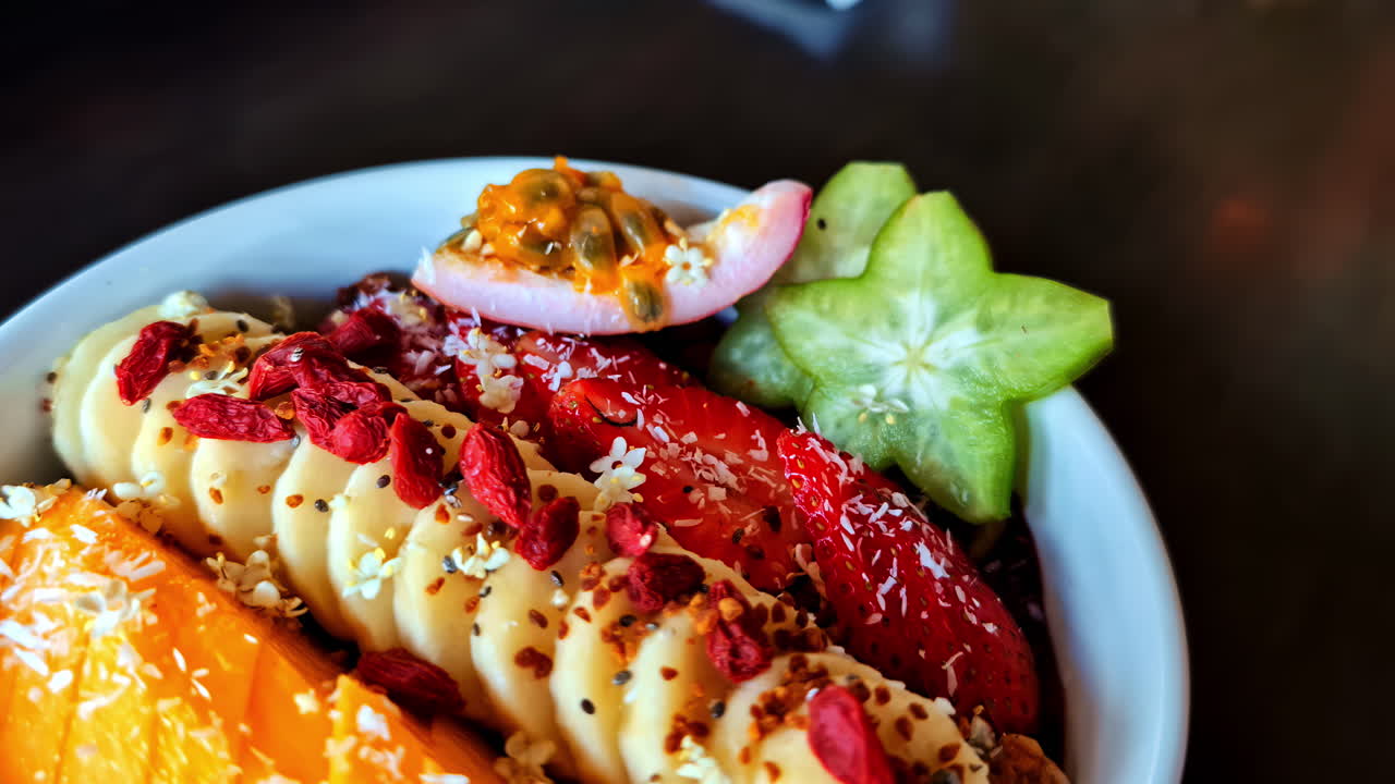 Fresh tropical fruit bowl featuring banana, mango, passionfruit, and starfruit in Bali