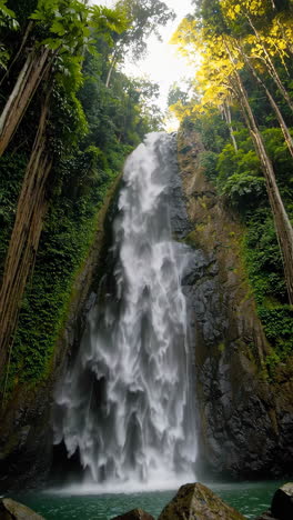 majestic waterfall in lush tropical forest