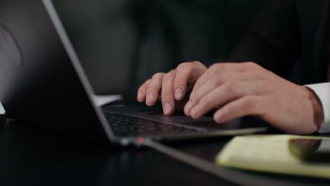 businessman working on laptop at night