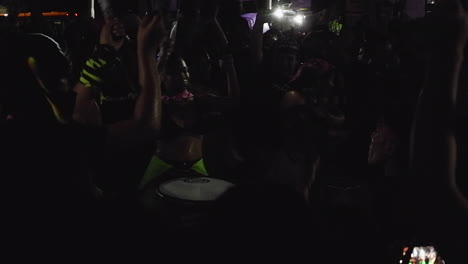female drummers rile up crowd at night protest march on women's day