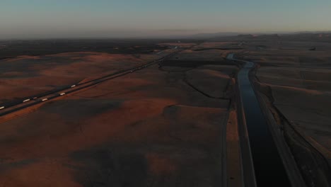 Aerial-of-the-highway-and-a-waterway-making-Los-Angeles,-California-possible