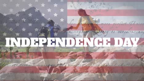 Animation-of-independence-day-text-over-flag-of-america,-biracial-couple-hiking-in-mountains