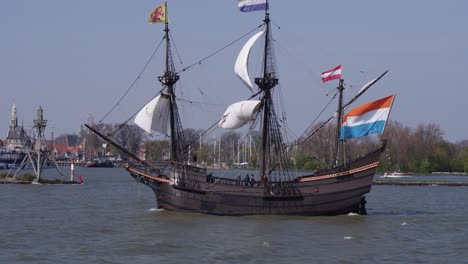 historic ship sailing in a harbor