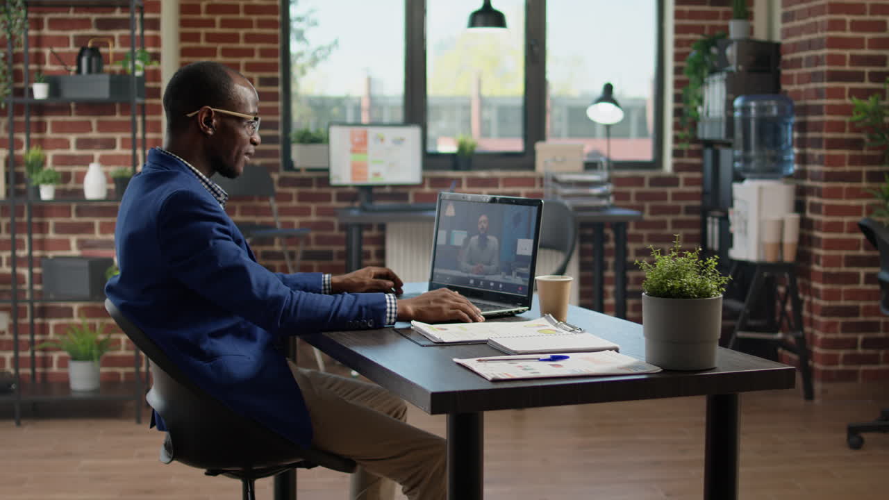 Executive assistant meeting with manager on videoconference