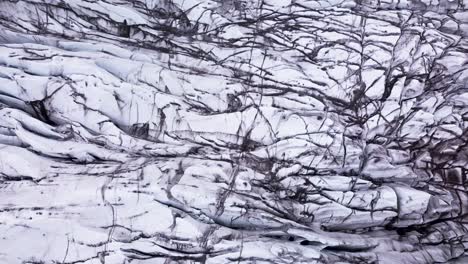 top-down drone view of mesmerizing ice patterns on a glacier in iceland