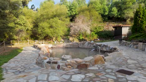 establishing shot of outariz thermal baths in ourense, galicia, spain, nestled in nature