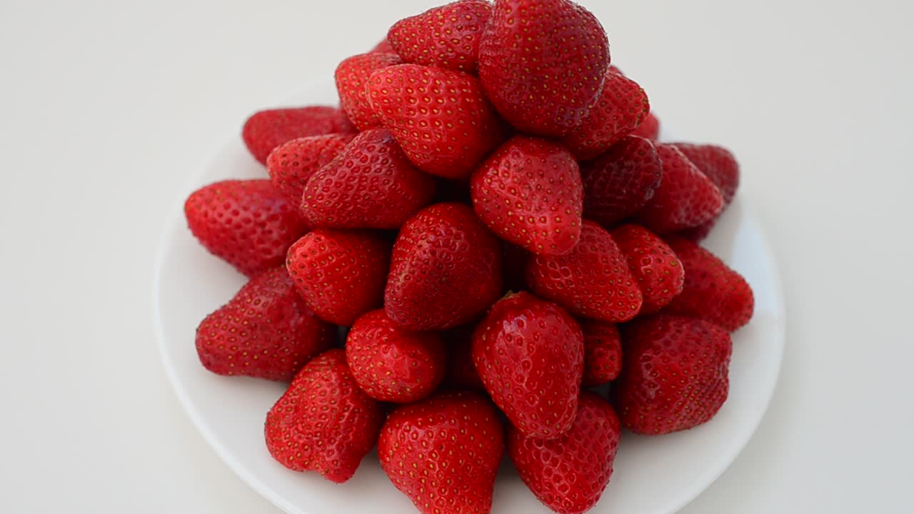 Strawberry on a white background, isolate. Shooting in the movement