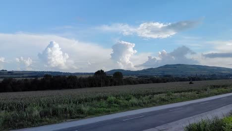 Road-and-car-traffic-surrounded-by-agricultural-land-1