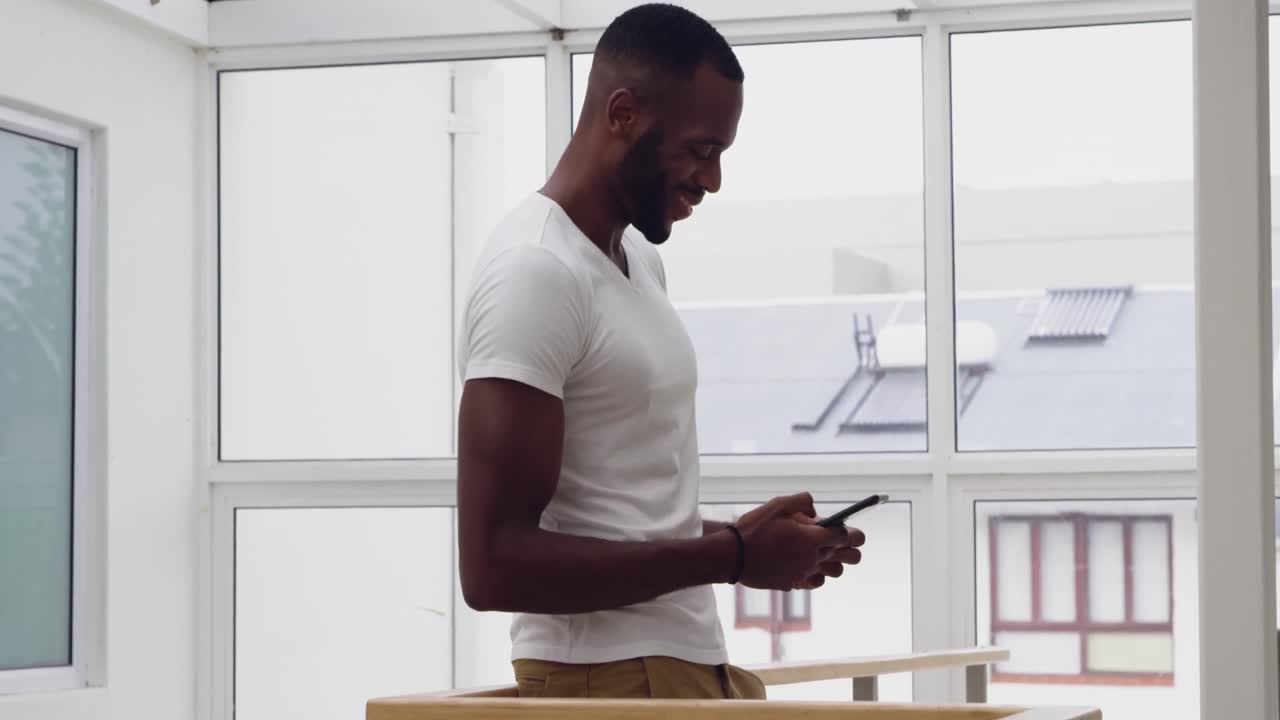 Young adult mixed race man enjoying time at home