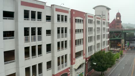 aerial of empty parking garage building structure in urban city