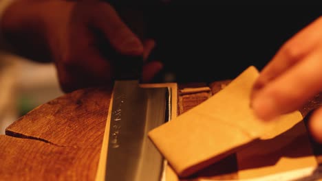 removing adhesive tape from a knife blade