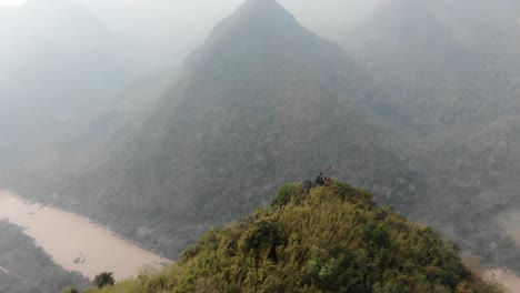 Orbit-around-viewpoint-at-remote-village-Muang-ngoy-Loas,-aerial