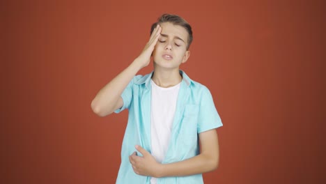 boy with headache.