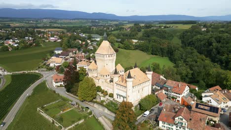 close orbit drone shot of vufflens medieval castle in vaud switzerland