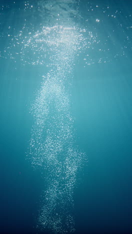 sunlight beams filter through the deep, crystal-clear, blue-turquoise water, casting a beautiful curtain of reflections
