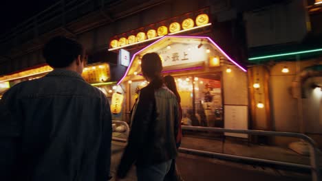 friends exploring a vibrant japanese night market