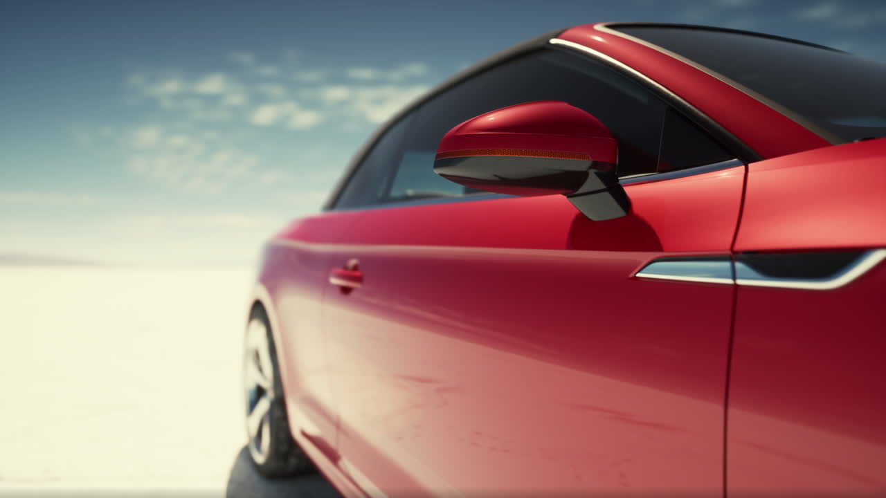 coche deportivo rojo en una carretera del desierto