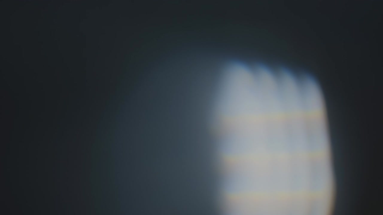 Abstract light leaks on black background.