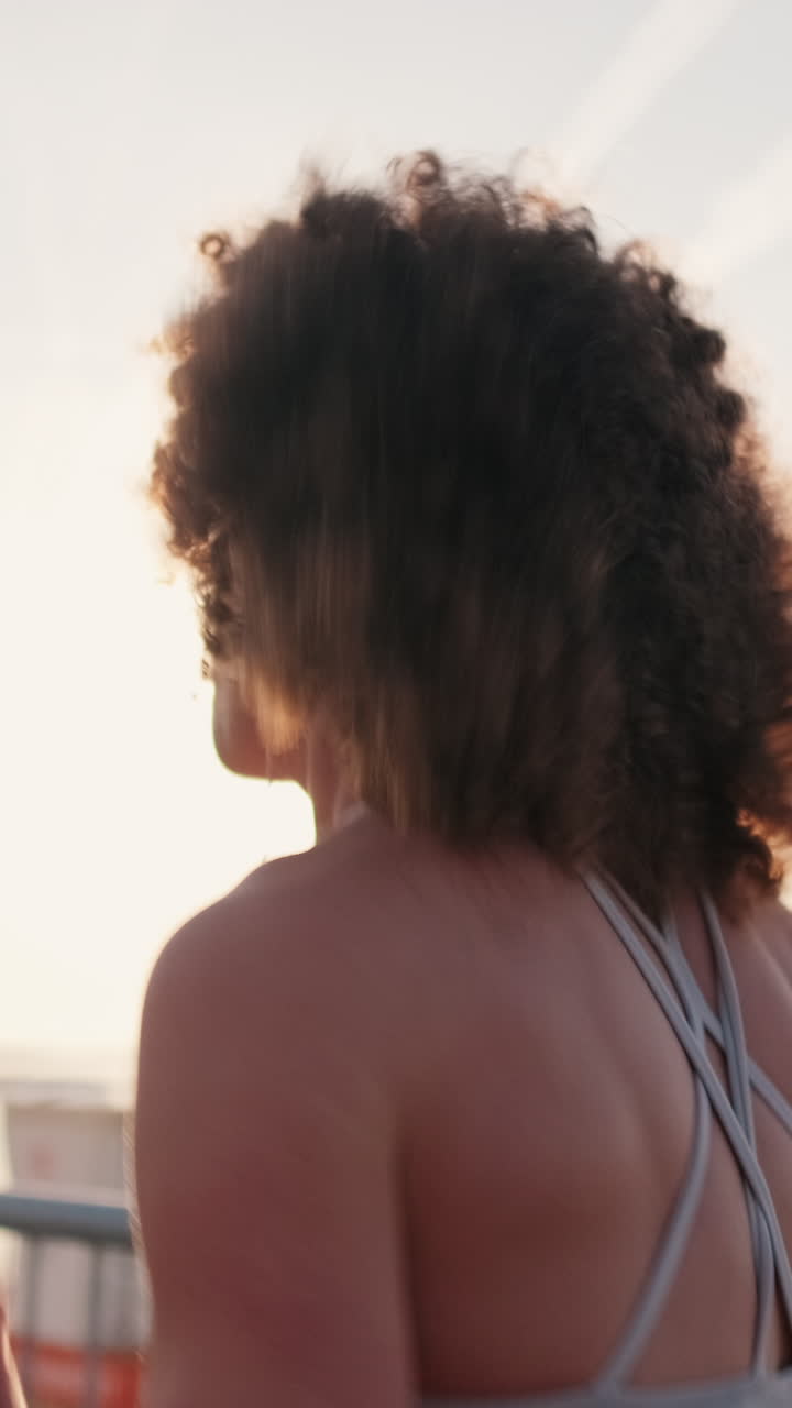 Woman Runs Along Pier at Sunrise