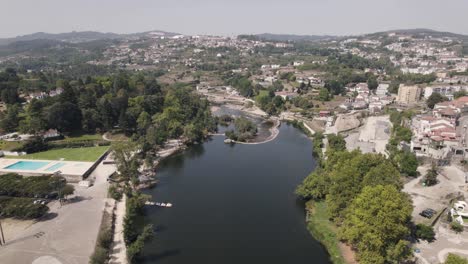 panoramic aerial pan shot capturing the spectacular view of tamega river at amarante portugal