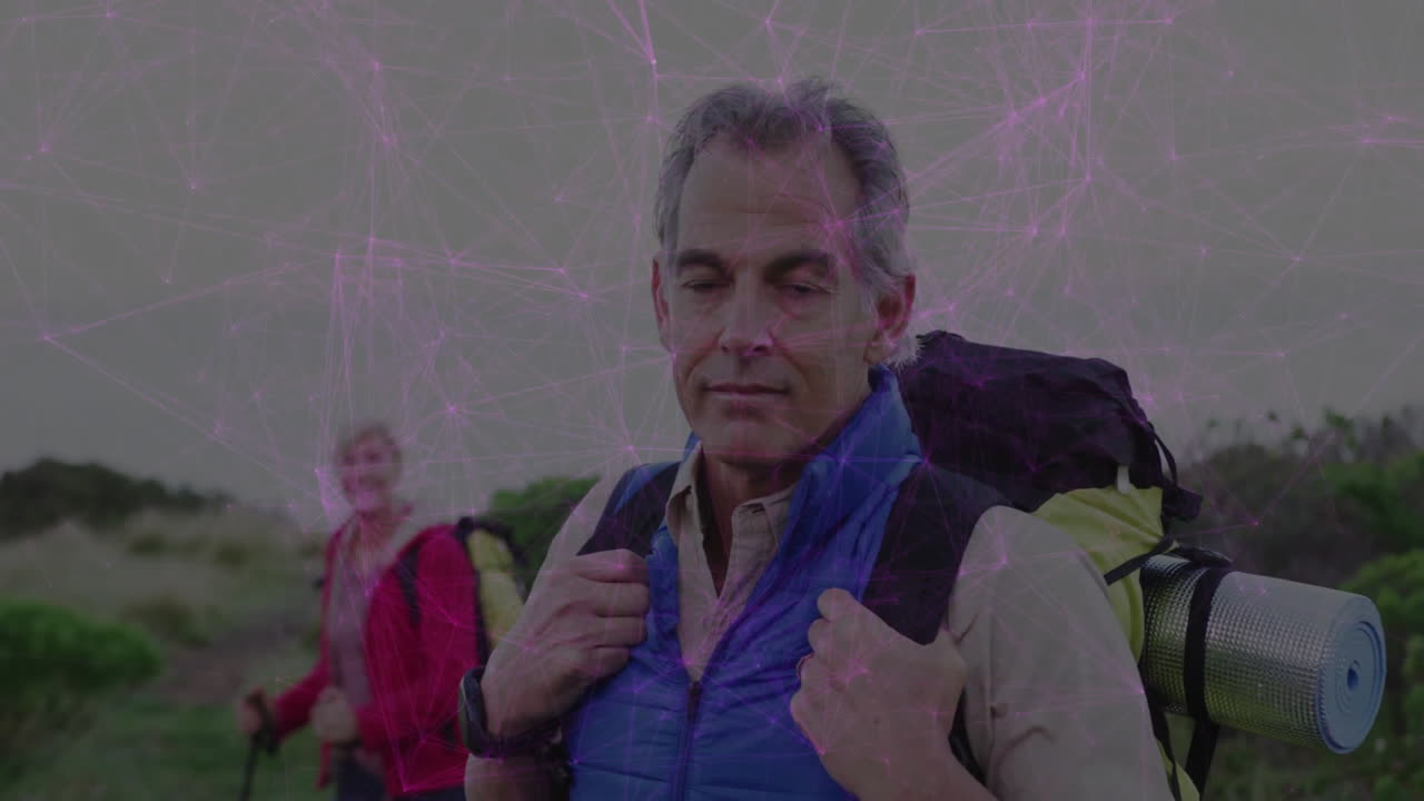 Male hiker standing on trail holding backpack straps, showing animated health graph and map