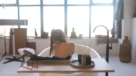 woman relaxing in a modern bathtub